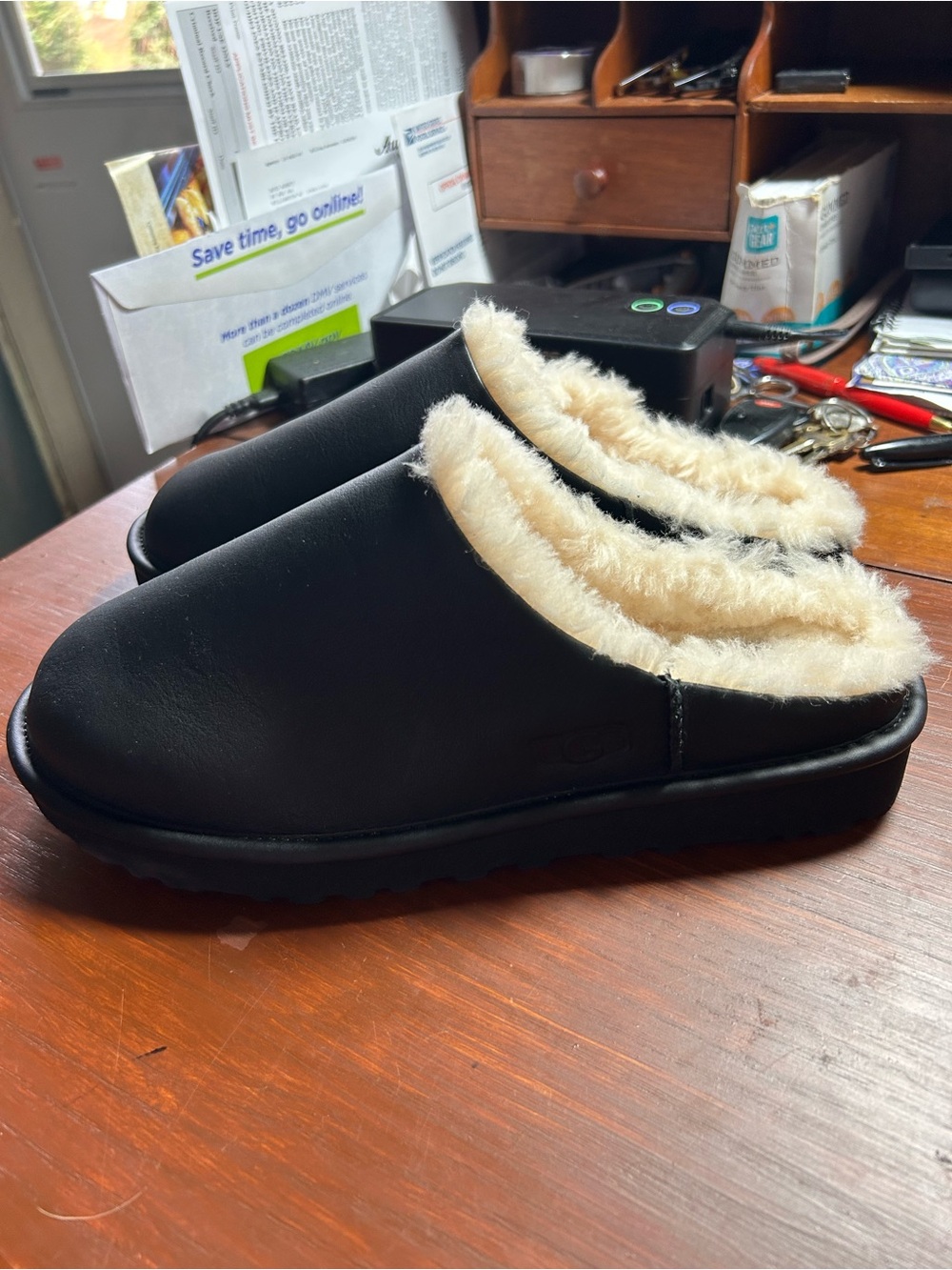 Men’s UGG Black Slip-On Clogs with Cream Faux-Fur Lining